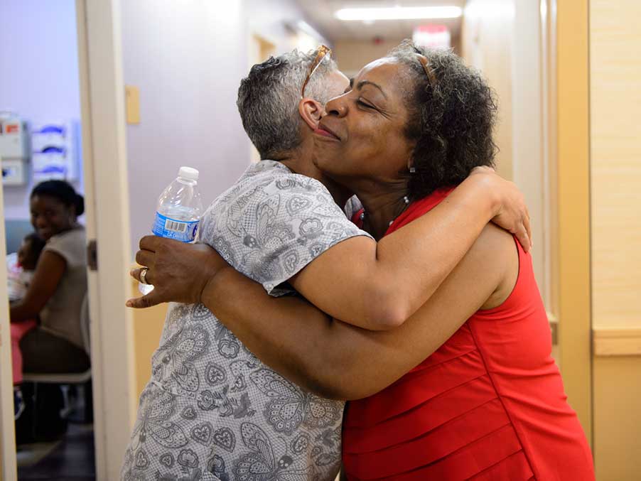 Two women hugging