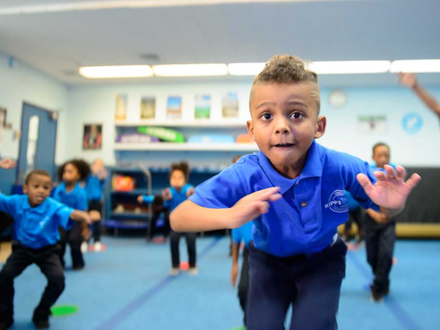 small kids in a gym class having fun