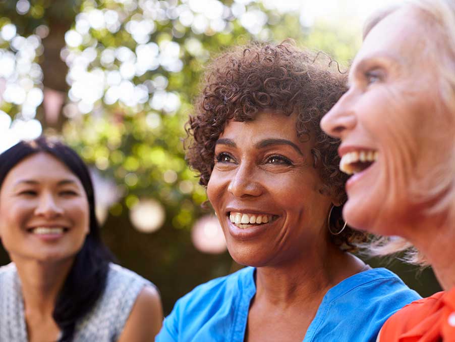 three ladies smiling