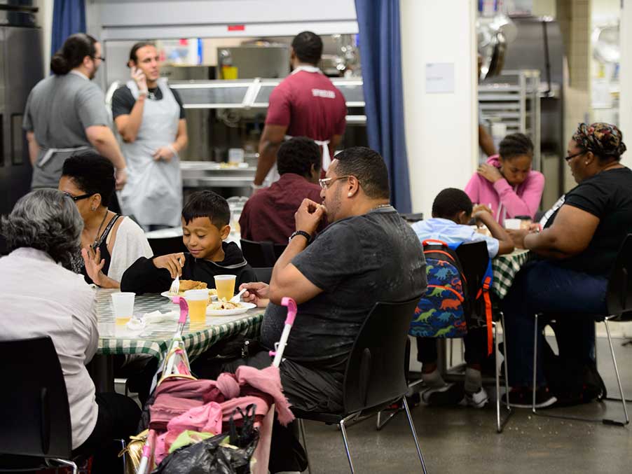 families eating dinner at a cafeteria